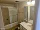 Modest bathroom featuring a shower-tub with sliding glass door and a single sink vanity at 7940 E Camelback Rd # 712, Scottsdale, AZ 85251
