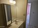 Modest bathroom featuring a vanity with an old style mirror and an attached medicine cabinet at 7940 E Camelback Rd # 712, Scottsdale, AZ 85251