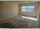 Bright bedroom featuring a large window, offering plenty of natural light and renovation potential at 7940 E Camelback Rd # 712, Scottsdale, AZ 85251