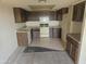 Traditional kitchen featuring dated appliances and dark wood cabinets, ready for renovation at 7940 E Camelback Rd # 712, Scottsdale, AZ 85251