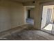Open-concept living area with sliding doors to a balcony, ready to be transformed into a cozy home at 7940 E Camelback Rd # 712, Scottsdale, AZ 85251