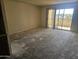 Bright living room featuring a balcony, ready for updates and new flooring at 7940 E Camelback Rd # 712, Scottsdale, AZ 85251