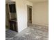 Spacious living room needing new flooring with a glimpse of a kitchen at 7940 E Camelback Rd # 712, Scottsdale, AZ 85251