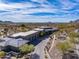 Breathtaking aerial view of a luxury estate surrounded by natural desert landscaping and mountain views at 8145 E Tecolote Cir, Scottsdale, AZ 85266