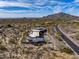 Panoramic aerial perspective of desert luxury home, with lush desert flora and fauna, and mountain views at 8145 E Tecolote Cir, Scottsdale, AZ 85266