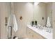 Bathroom featuring a vanity, a large mirror, and a walk-in shower for a fresh, clean aesthetic at 8145 E Tecolote Cir, Scottsdale, AZ 85266