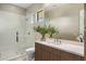 Contemporary bathroom with glass shower and sleek vanity with modern fixtures at 8145 E Tecolote Cir, Scottsdale, AZ 85266