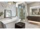 Spa-like bathroom featuring a soaking tub, and glass enclosed shower at 8145 E Tecolote Cir, Scottsdale, AZ 85266