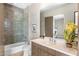 Stylish bathroom featuring a shower over tub with glass screen and floating vanity at 8145 E Tecolote Cir, Scottsdale, AZ 85266