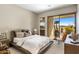 Comfortable bedroom with plush carpet, neutral color scheme, and an outdoor view at 8145 E Tecolote Cir, Scottsdale, AZ 85266