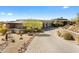Stunning desert home with a circular driveway, native landscaping, and beautiful architecture at 8145 E Tecolote Cir, Scottsdale, AZ 85266