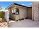 Stylish exterior elevation showcasing well-maintained landscaping and decorative rock features at 8145 E Tecolote Cir, Scottsdale, AZ 85266