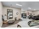 Spacious garage with multiple parking spots, epoxy flooring, and fitness equipment at 8145 E Tecolote Cir, Scottsdale, AZ 85266