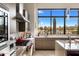 Modern kitchen featuring stainless steel appliances, gas range, and scenic desert views at 8145 E Tecolote Cir, Scottsdale, AZ 85266