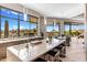 Open kitchen with large island, stainless steel sink, modern fixtures, and scenic desert views at 8145 E Tecolote Cir, Scottsdale, AZ 85266