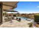 Inviting outdoor patio with a pool, lounge chairs, and desert views, perfect for relaxation and entertaining at 8145 E Tecolote Cir, Scottsdale, AZ 85266