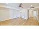 Bright bedroom with wood floors, a modern ceiling fan, and fresh white walls at 9115 E Purdue Ave # 114, Scottsdale, AZ 85258