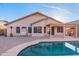 The backyard features a pool and paver patio, perfect for outdoor entertaining at 9212 E Cedar Basin Ln, Gold Canyon, AZ 85118