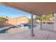 Relaxing backyard retreat featuring a covered patio with views of the refreshing pool at 9212 E Cedar Basin Ln, Gold Canyon, AZ 85118
