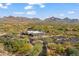 Aerial view of community amenities, lush landscaping, and stunning mountain views at 9270 E Thompson Peak Pkwy # 370, Scottsdale, AZ 85255