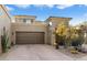 Stunning exterior shot of a stucco home featuring desert landscaping and a two-car garage at 9270 E Thompson Peak Pkwy # 370, Scottsdale, AZ 85255