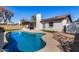 Backyard with a pool, grass and a patio at 951 W La Jolla Dr, Tempe, AZ 85282