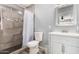 Updated bathroom features a tiled shower and modern vanity with white cabinets at 951 W La Jolla Dr, Tempe, AZ 85282