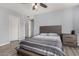 Inviting main bedroom features neutral walls, vinyl wood floors, and ample closet space at 951 W La Jolla Dr, Tempe, AZ 85282
