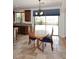 Open kitchen with stainless appliances and a dining area adjacent to a backyard patio at 9901 E Bahia Dr, Scottsdale, AZ 85260
