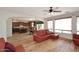 Open-concept layout with a modern kitchen and living room connected by hardwood flooring at 9901 E Bahia Dr, Scottsdale, AZ 85260