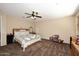 Primary bedroom with ceiling fan, carpeted floors, and neutral paint for a relaxing atmosphere at 9901 E Bahia Dr, Scottsdale, AZ 85260