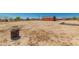 Large backyard showing parking shed, plenty of parking space, and potential for expansion at 1015 N 193Rd Ave, Buckeye, AZ 85326