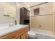 Bathroom with tile accents, vanity, toilet and shower and storage at 1015 N 193Rd Ave, Buckeye, AZ 85326