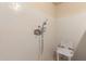 Bathroom with white tile shower and chair for handicap accessibility at 1015 N 193Rd Ave, Buckeye, AZ 85326