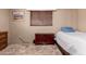 Comfortable bedroom featuring a classic wood nightstand and window at 1015 N 193Rd Ave, Buckeye, AZ 85326