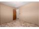 Bedroom with beige walls, tile flooring, and closet at 1015 N 193Rd Ave, Buckeye, AZ 85326