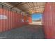 Interior view of an outbuilding featuring a metal roof, storage, and potential workshop space at 1015 N 193Rd Ave, Buckeye, AZ 85326