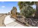 Serene backyard featuring a winding path, mature trees, and lush greenery, offering a peaceful and private outdoor space at 10417 N 180Th Dr, Waddell, AZ 85355