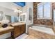 Bathroom featuring a single sink and vanity next to a bathtub and shower combination at 10417 N 180Th Dr, Waddell, AZ 85355