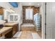 Bathroom with a large tub and shower with decorative tile and dual sinks at 10417 N 180Th Dr, Waddell, AZ 85355