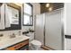 Elegant bathroom featuring a shower with glass doors, a toilet, and a vanity at 10417 N 180Th Dr, Waddell, AZ 85355