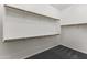 Bright walk-in closet with ample shelving and hanging rods, offering plenty of storage at 10417 N 180Th Dr, Waddell, AZ 85355