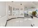 Elegant room featuring plantation shutters offering privacy and style with sleek tile flooring and modern lighting fixtures at 10417 N 180Th Dr, Waddell, AZ 85355