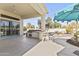 Outdoor kitchen featuring a built-in grill and bar, perfect for entertaining at 10417 N 180Th Dr, Waddell, AZ 85355