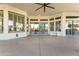 Covered patio area with sliding doors, a ceiling fan and plenty of room at 10417 N 180Th Dr, Waddell, AZ 85355