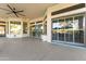 Patio area featuring sliding doors with outdoor furniture, perfect for lounging at 10417 N 180Th Dr, Waddell, AZ 85355