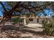 Desert-landscaped backyard featuring a screened-in porch area at 10609 W Concho Cir, Sun City, AZ 85373