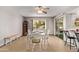 Bright dining area featuring a white table, and chairs with a view to the backyard at 10609 W Concho Cir, Sun City, AZ 85373