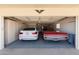 Spacious two-car garage featuring built-in storage and an eagle decoration at 10609 W Concho Cir, Sun City, AZ 85373