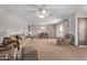 Open living room and dining room combination space with neutral carpeting at 10609 W Concho Cir, Sun City, AZ 85373